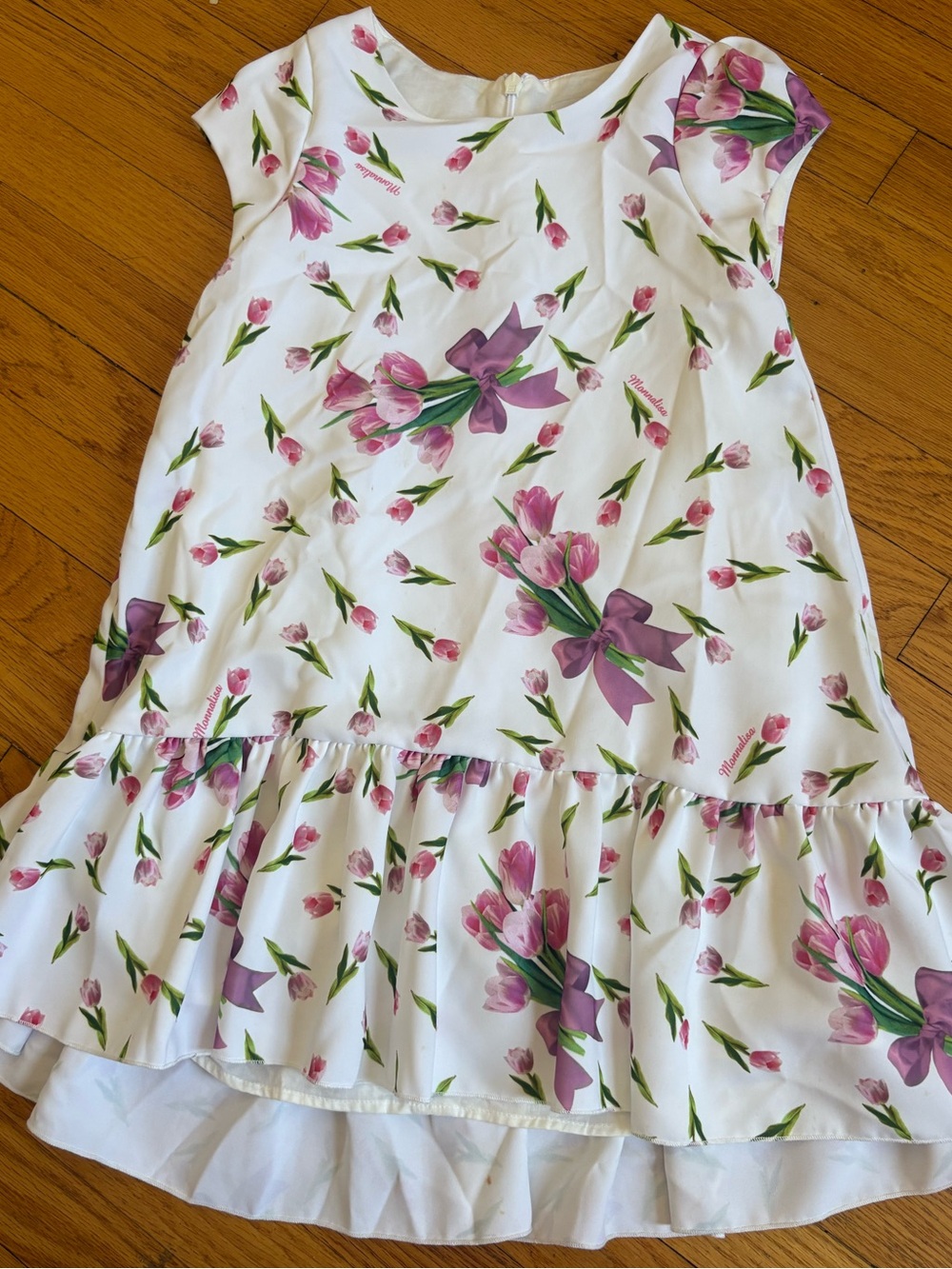MonnaLisa White Dress with Pink Tulip Bouquet and Purple Bow Accents